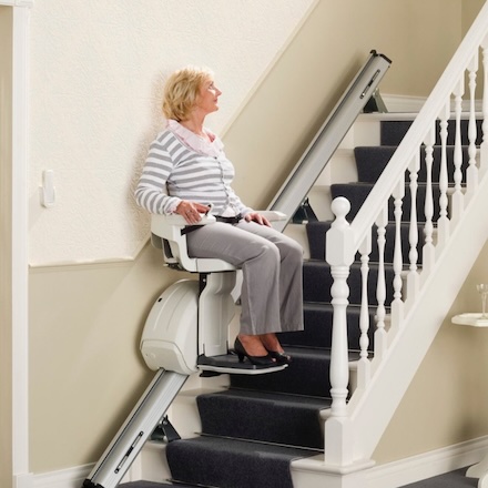 woman on homeglide stairlift